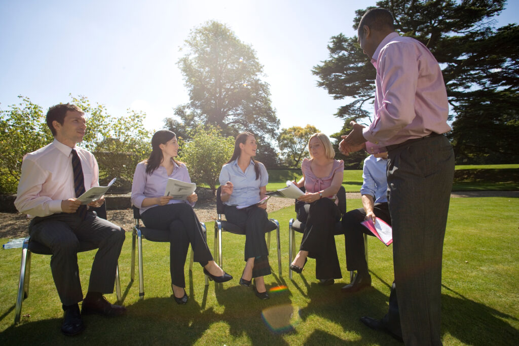 A leadership development program is being held outdoors